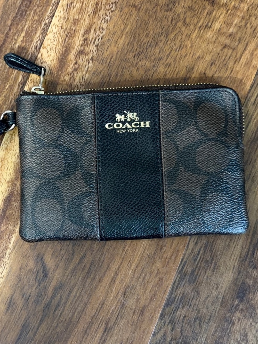 COACH CORNER ZIP WRISTLET IN SIGNATURE BROWN CANVAS